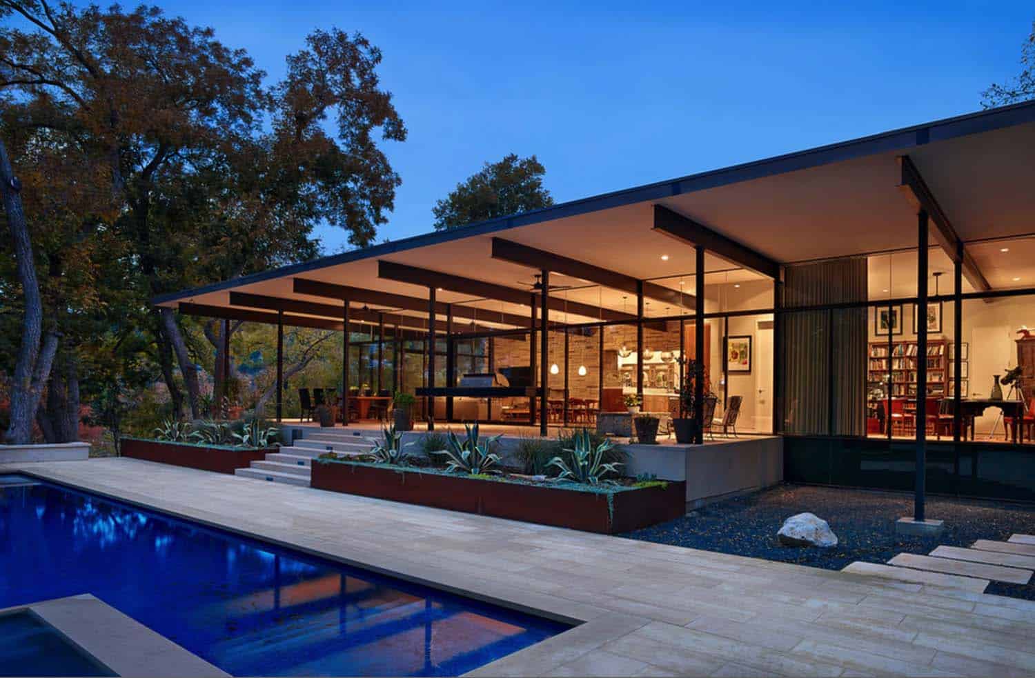 Creekside home of glass and steel infused with warmth in Austin