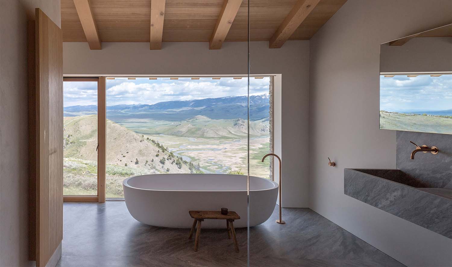A minimally designed home perched over the Teton Mountain Range