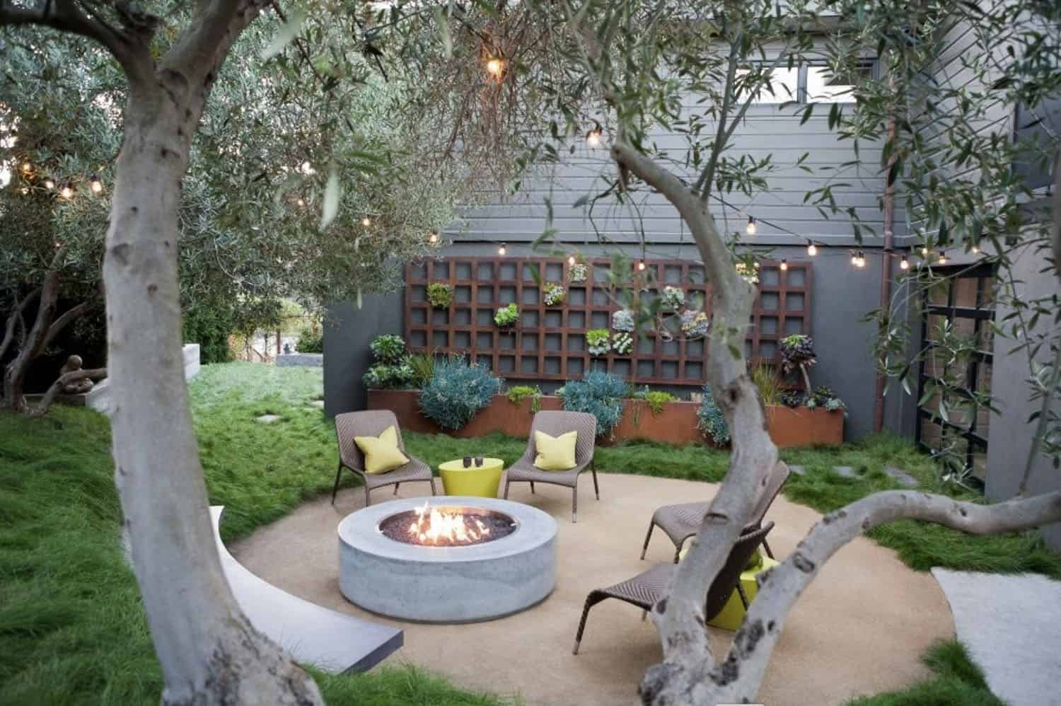 concrete fire pit with a built-in bench seat and succulent garden wall