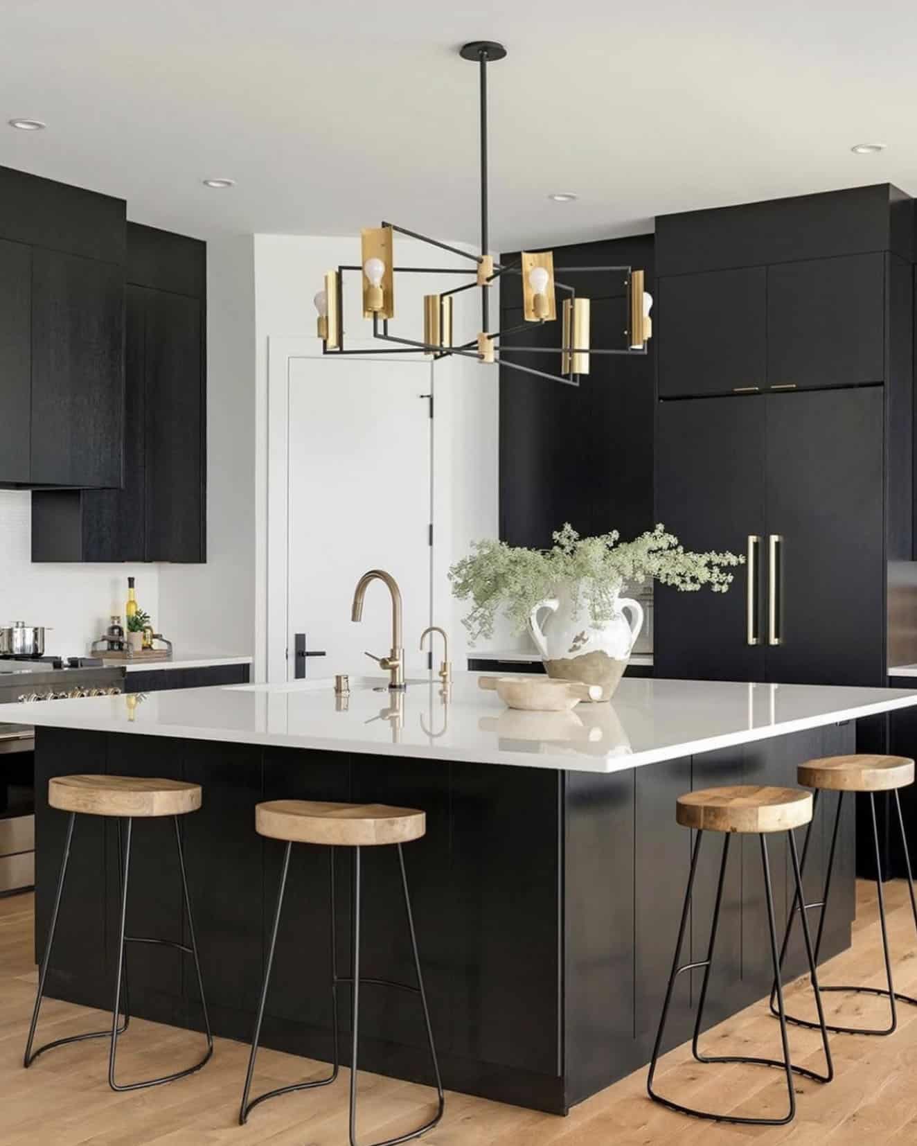 mountain modern style kitchen with black cabinets and white countertops