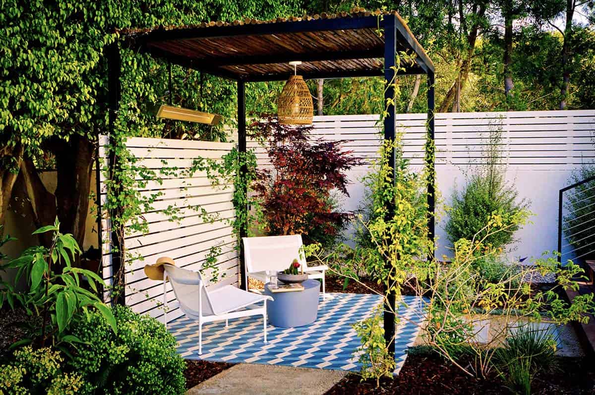 12:13 PMClaude responded: Modern backyard pergola with climbing vines, Japanese maple, white lounge chairs, and a chevron-painted concrete patioModern backyard pergola with climbing vines, Japanese maple, white lounge chairs, and a chevron-painted concrete patio