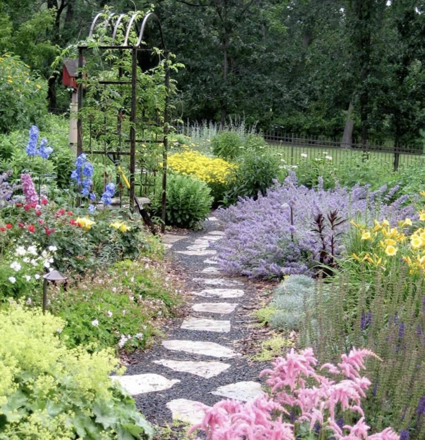 stone pathway with lush gardens