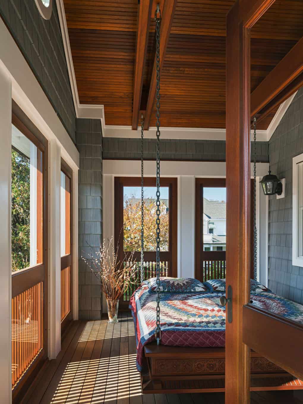 sleeping porch with hanging bed with aztec style blanket 