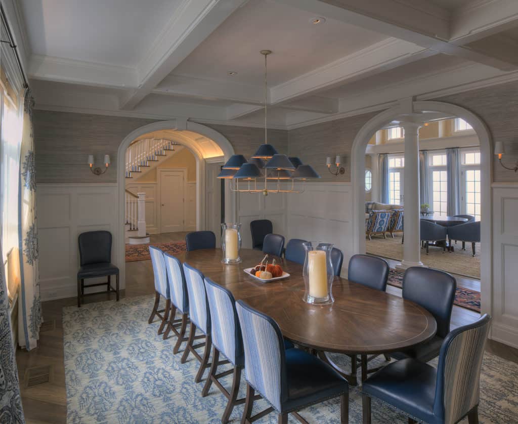 Step into this shingle-style home perched on the serene shores of Lake ...