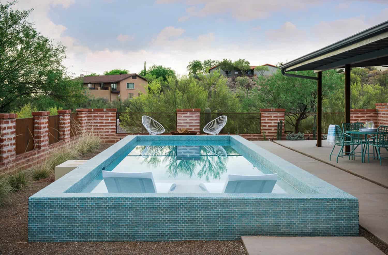 bright blue small rectangle pool with sitting area 
