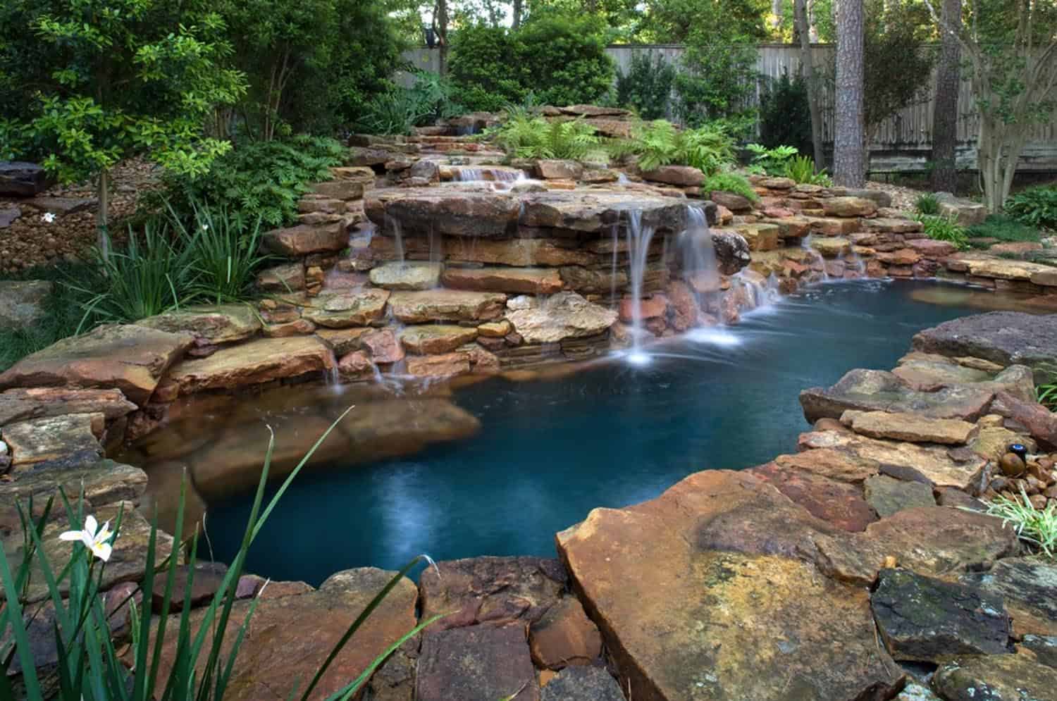 pool with rock formation waterfall 