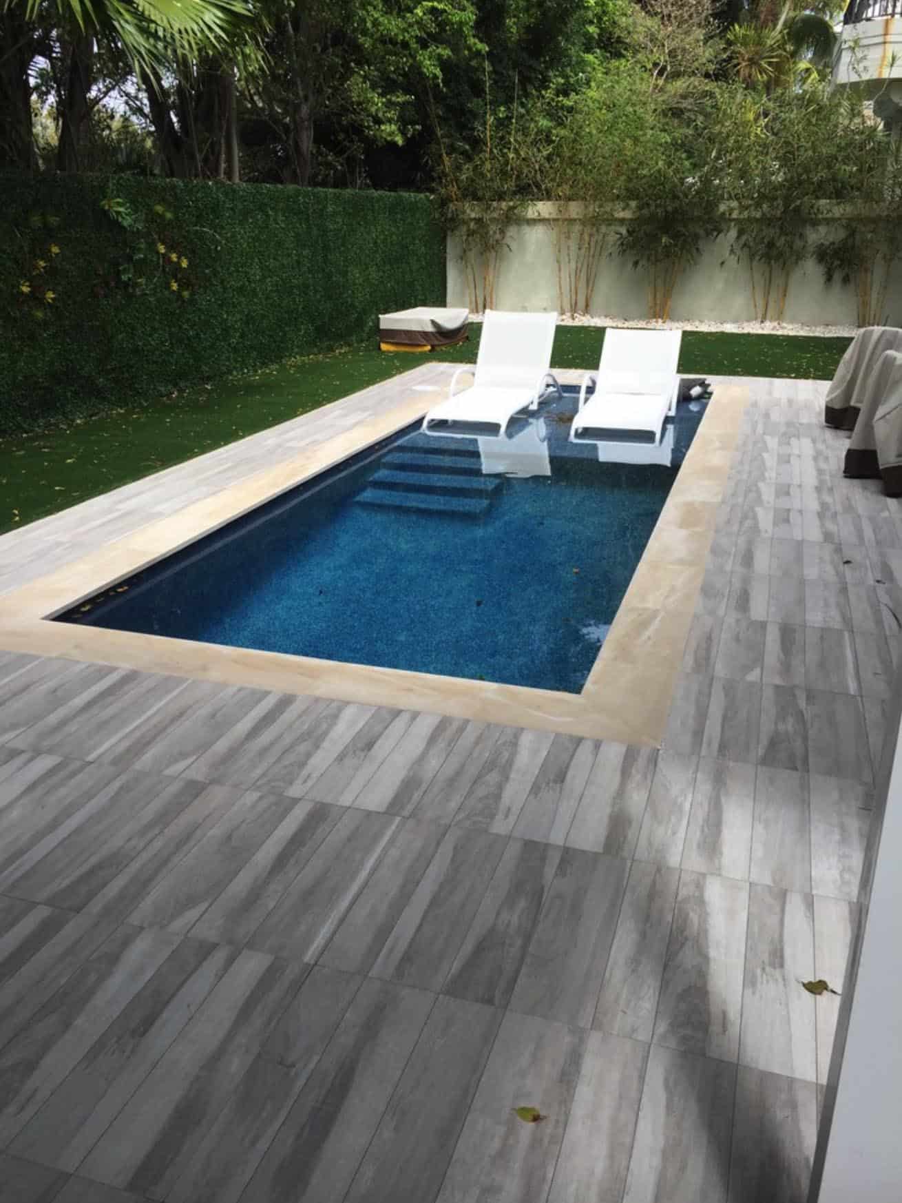small pool with sitting area in the pool 