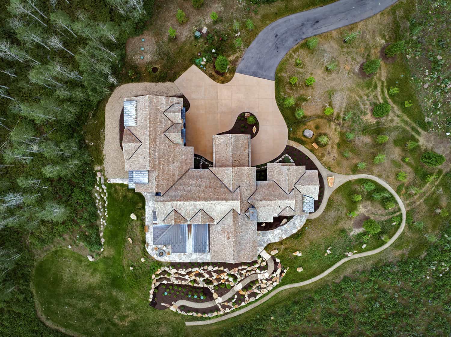 rustic-hillside-lodge-home-exterior-aerial-view