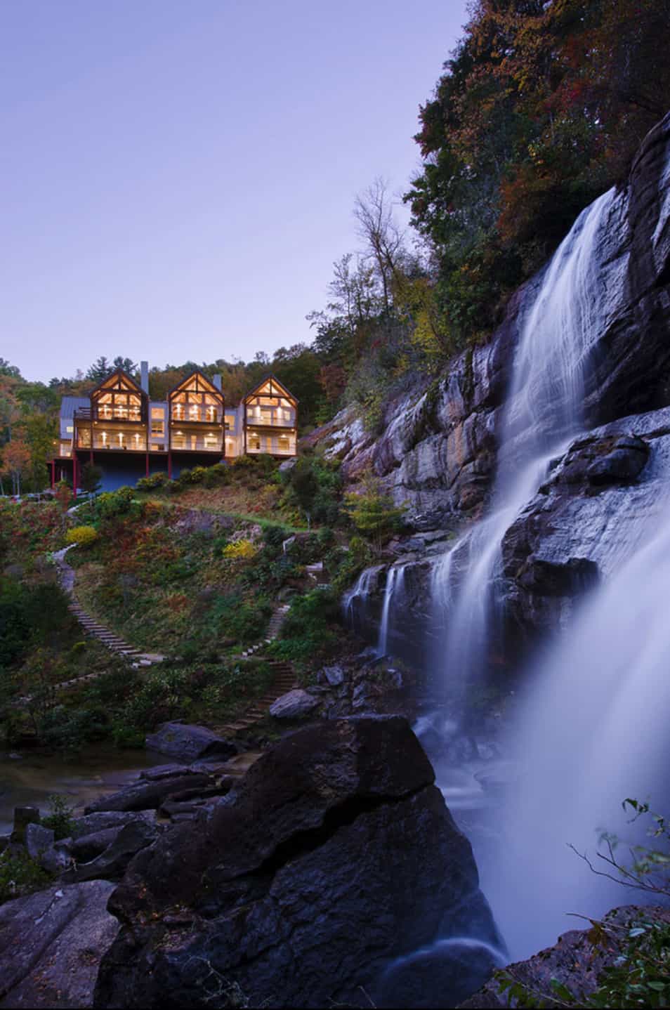contemporary-mountainside-retreat-with-waterfall-view-at-dusk
