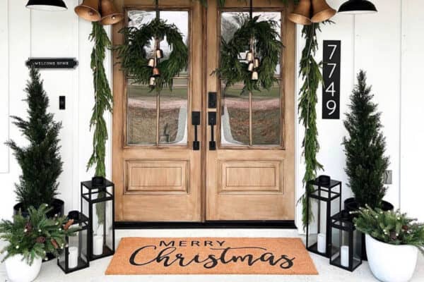 front-porch-christmas-decor-with-garland-and-trees