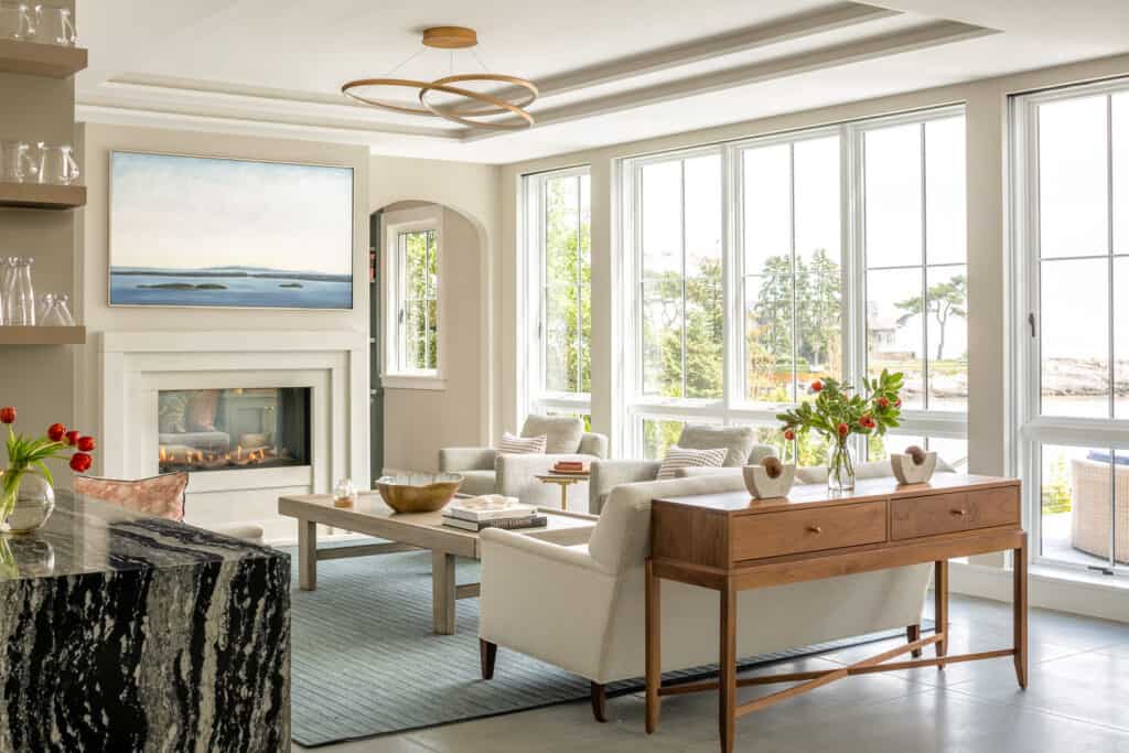 A modern shingle-style home rests peacefully on the Maine coast