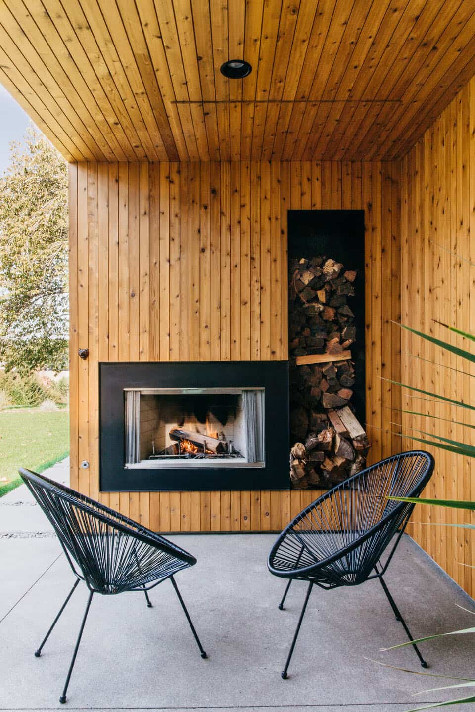 modern-scandinavian-home-covered-patio-with-a-fireplace