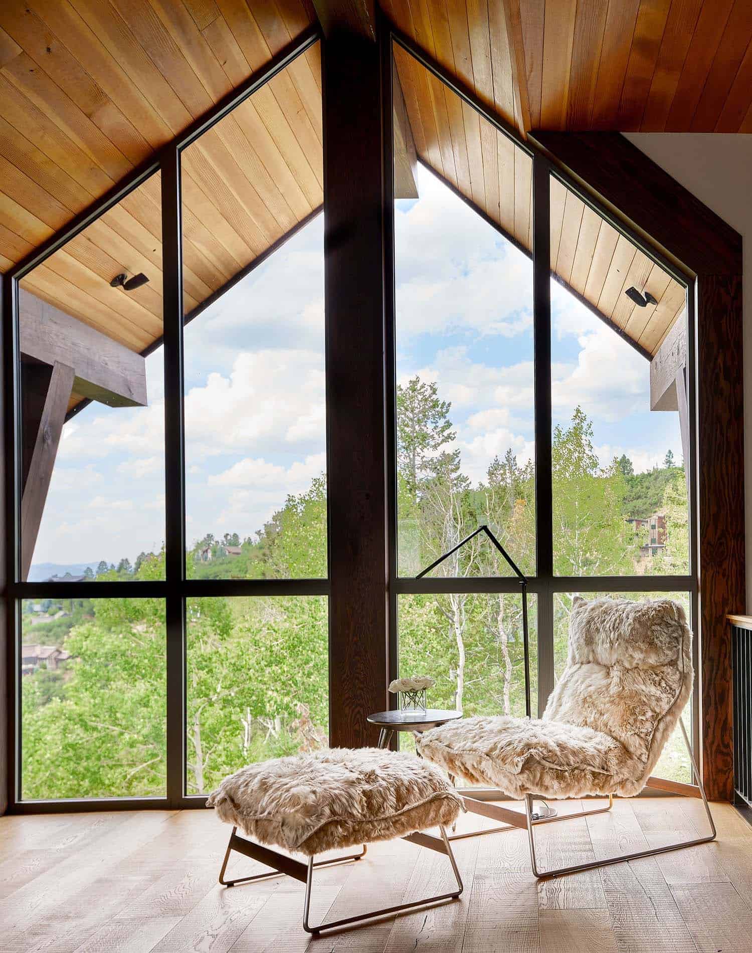 modern-rustic-lounge-chair-and-ottoman-with-a-window-view