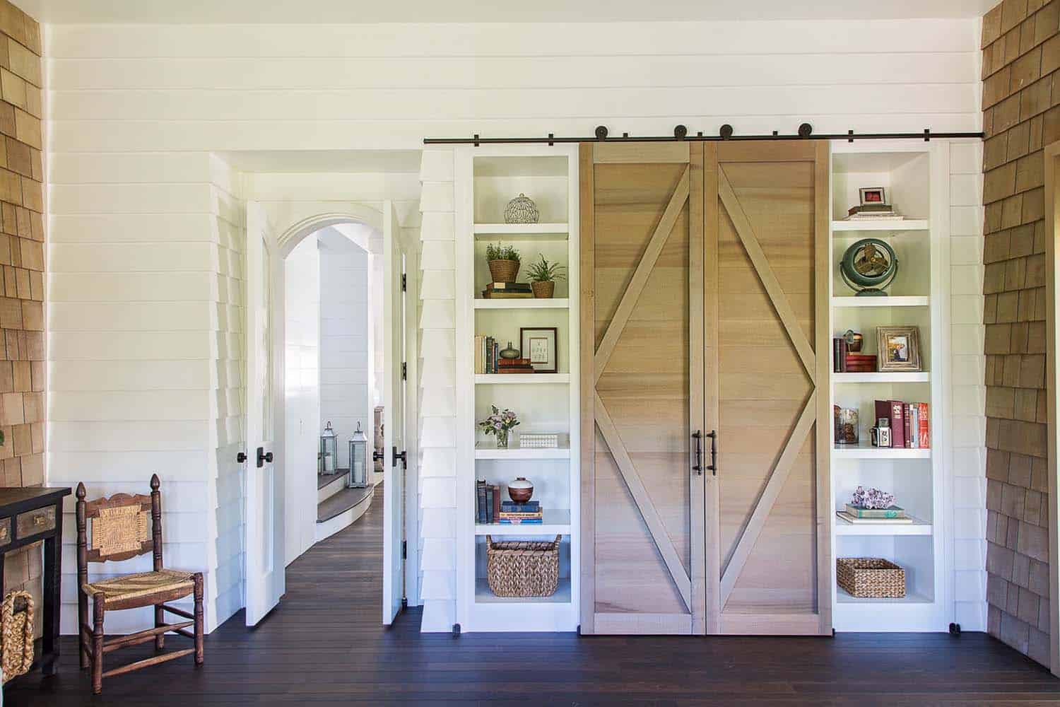 beach-style-built-in-entertainment-center-with-sliding-barn-doors