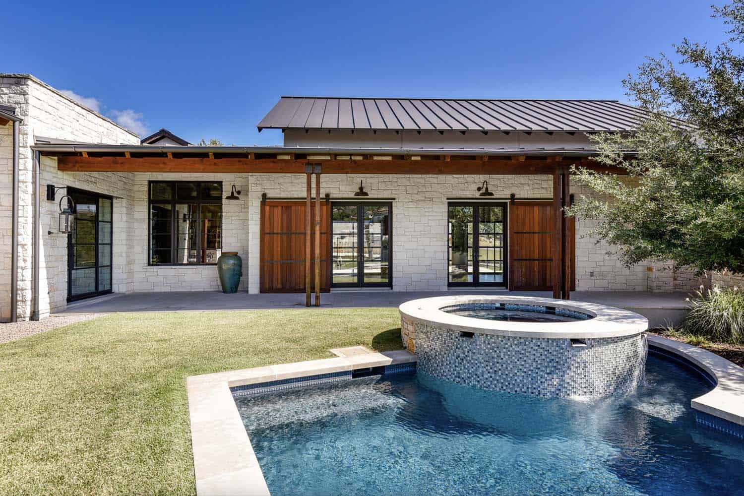 transitional-home-patio-with-a-pool-and-hot-tub