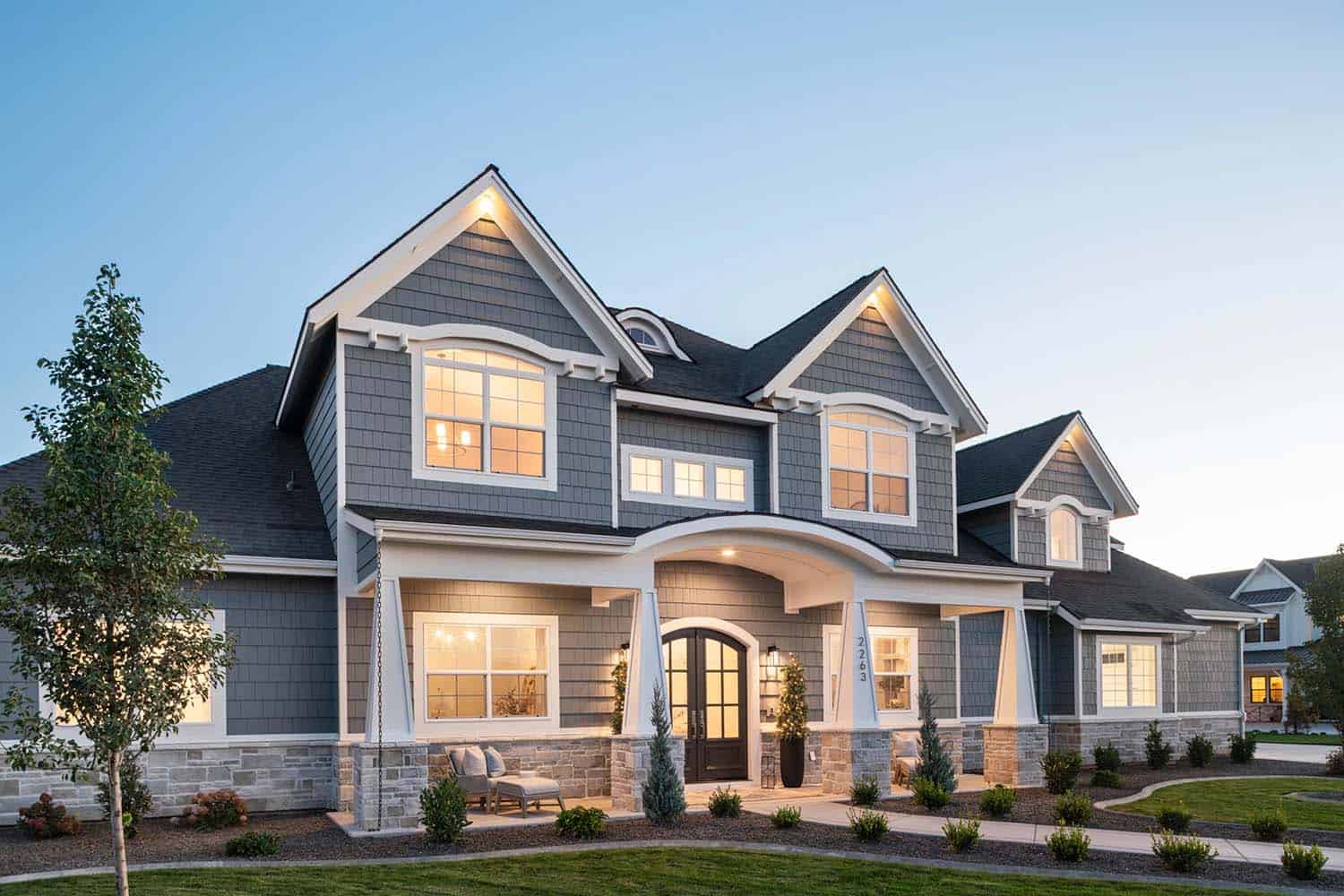 coastal-craftsman-style-home-exterior-at-dusk