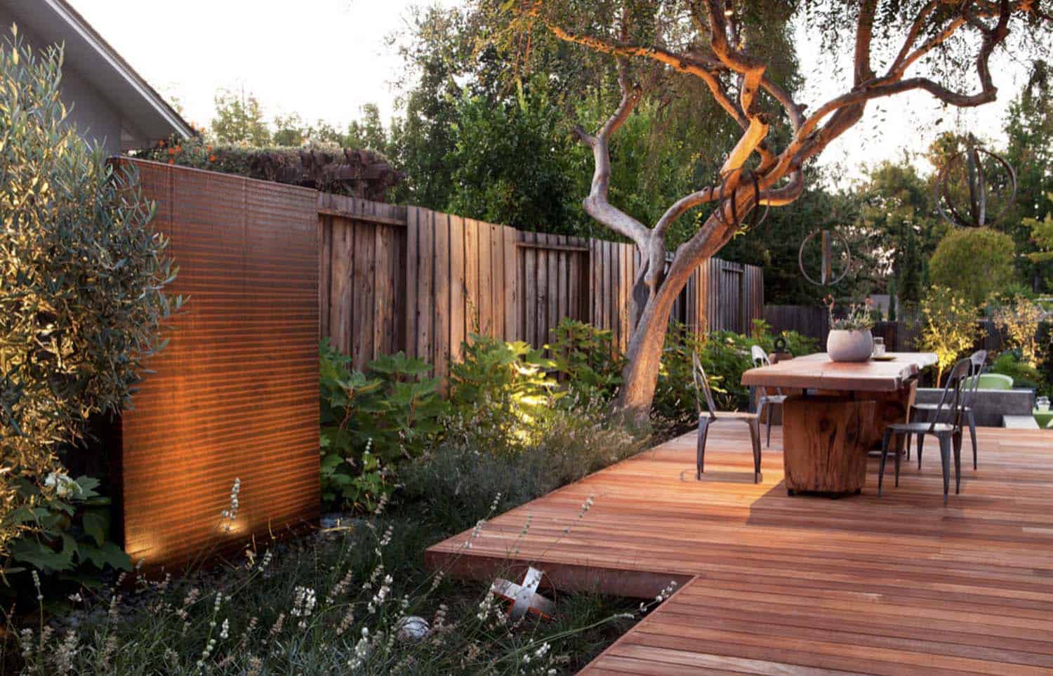 backyard-deck-with-a-large-tree-and-privacy-wall