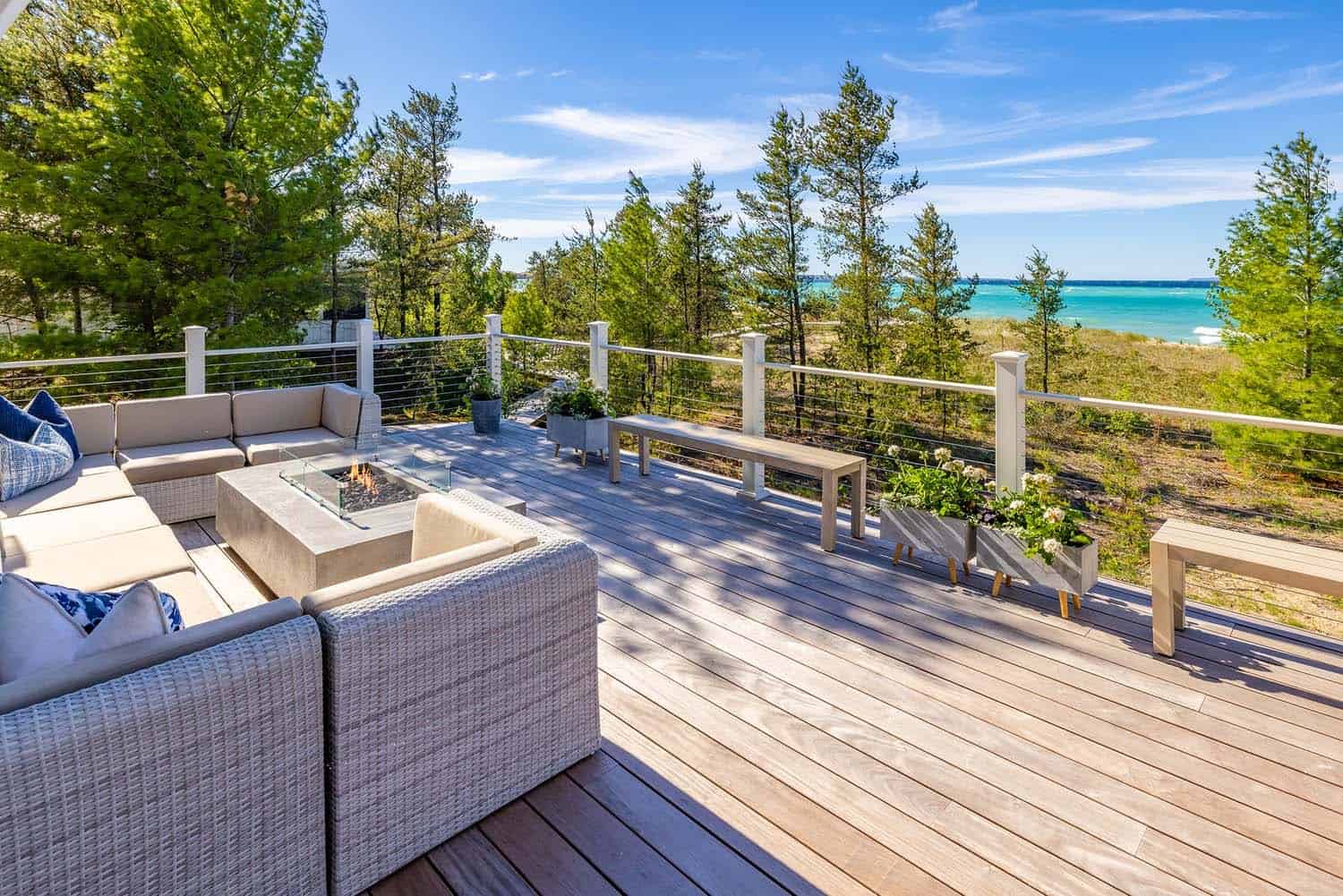 lake-house-patio-with-a-wicker-sectional-and-fire-pit
