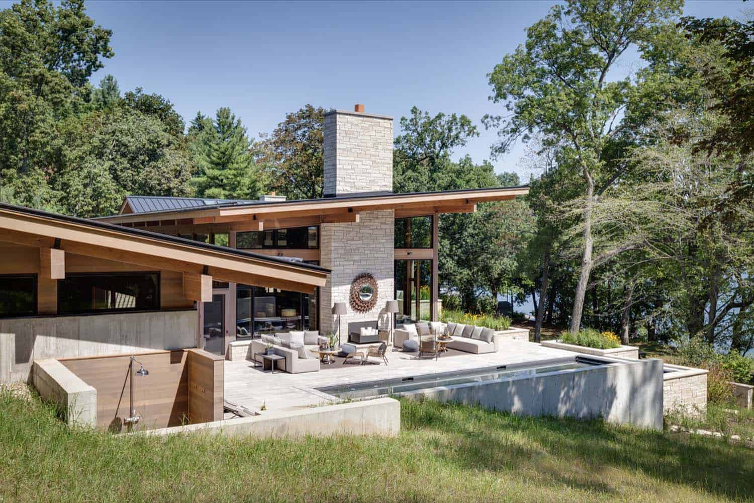 lakeside-resort-home-modern-exterior-pool-and-patio