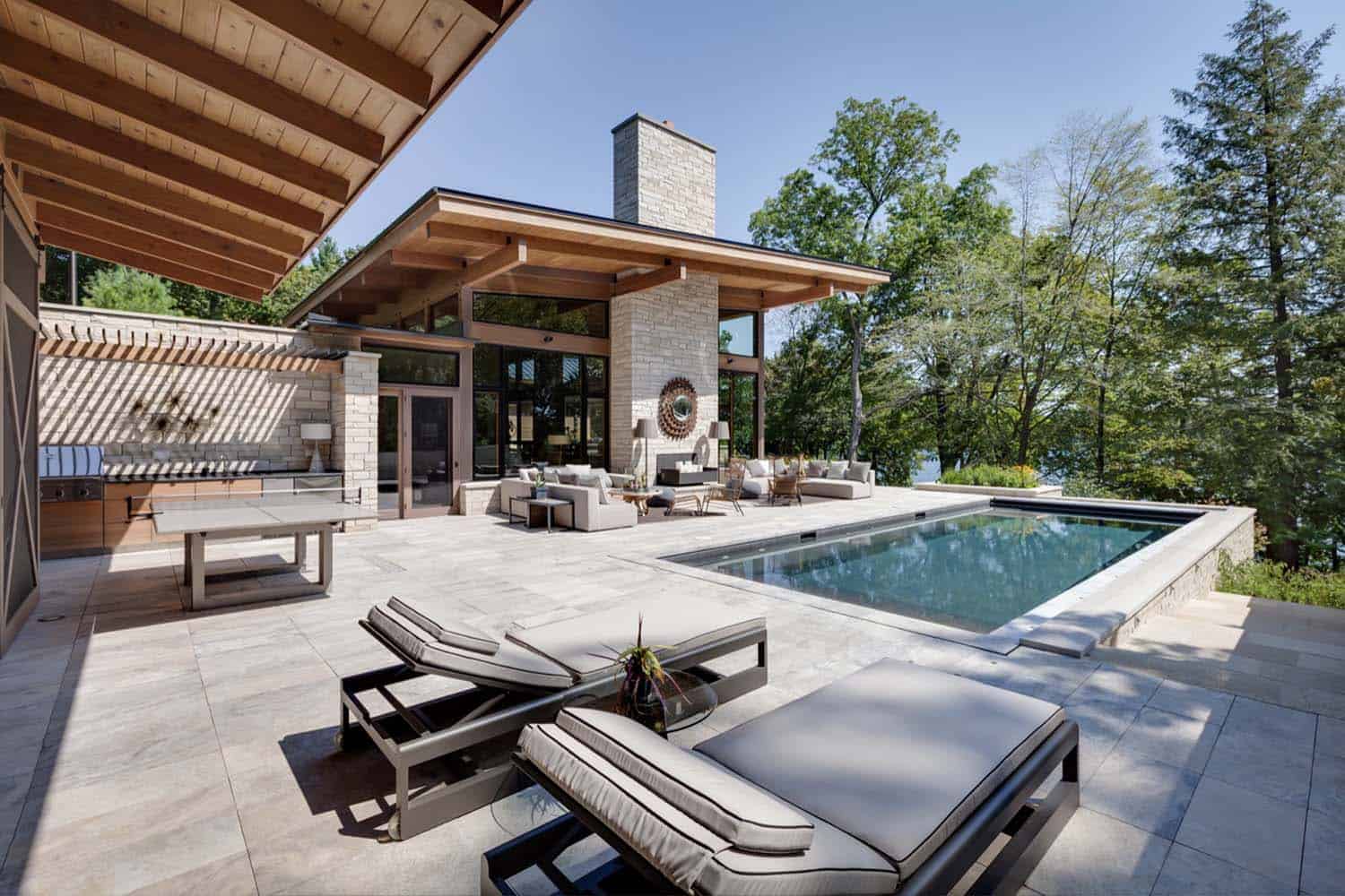 lakeside-resort-home-modern-exterior-pool-and-patio