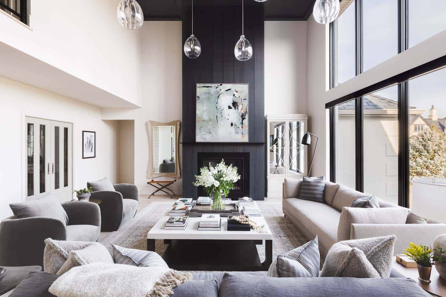 transitional style living room with high ceilings and a fireplace