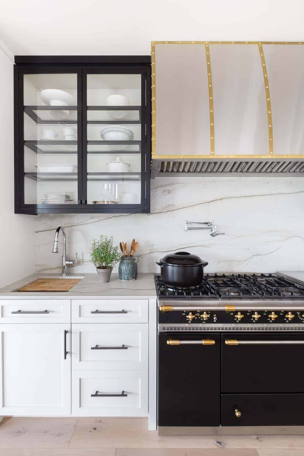 transitional style kitchen cabinets and a range