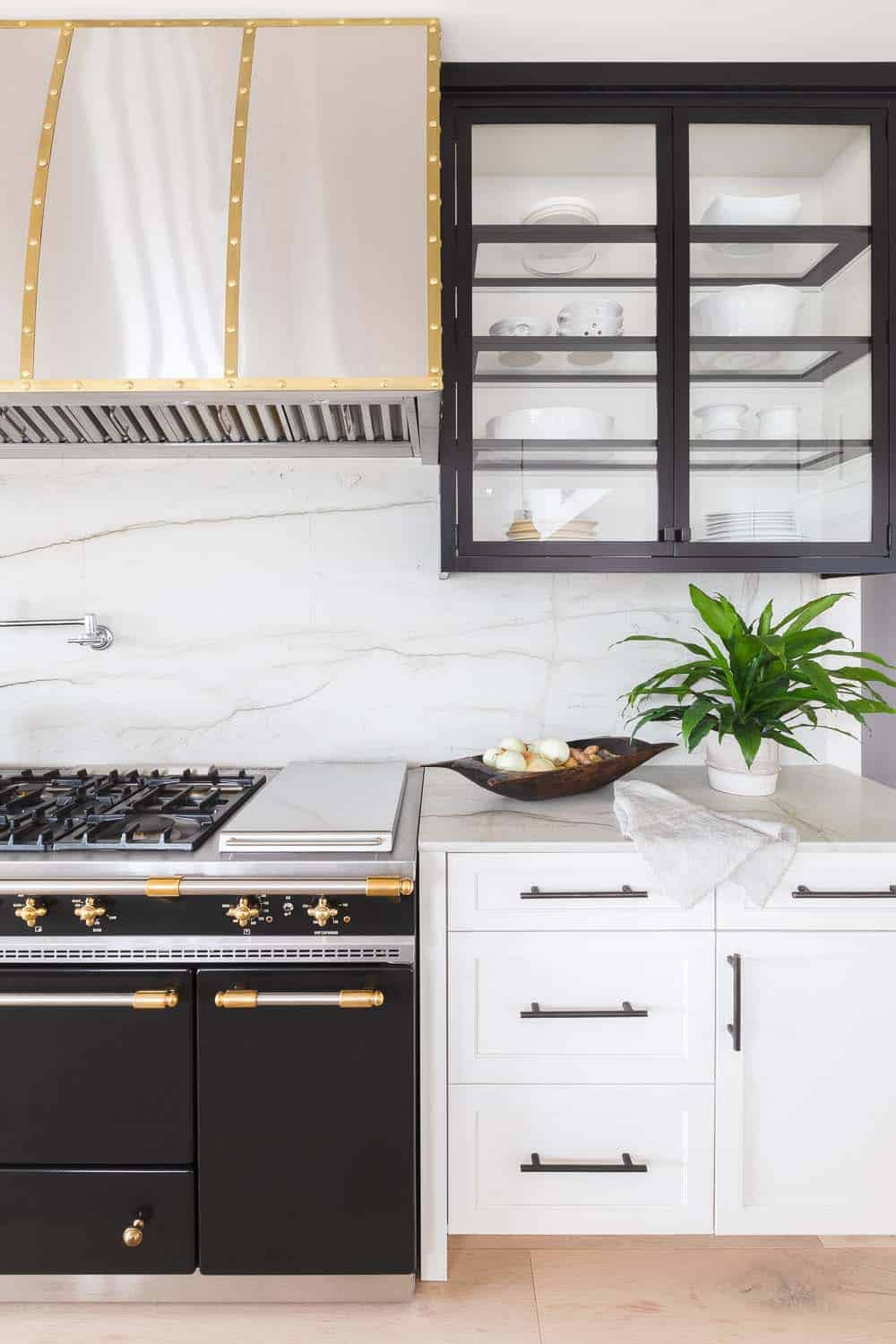 transitional style kitchen cabinets and a range