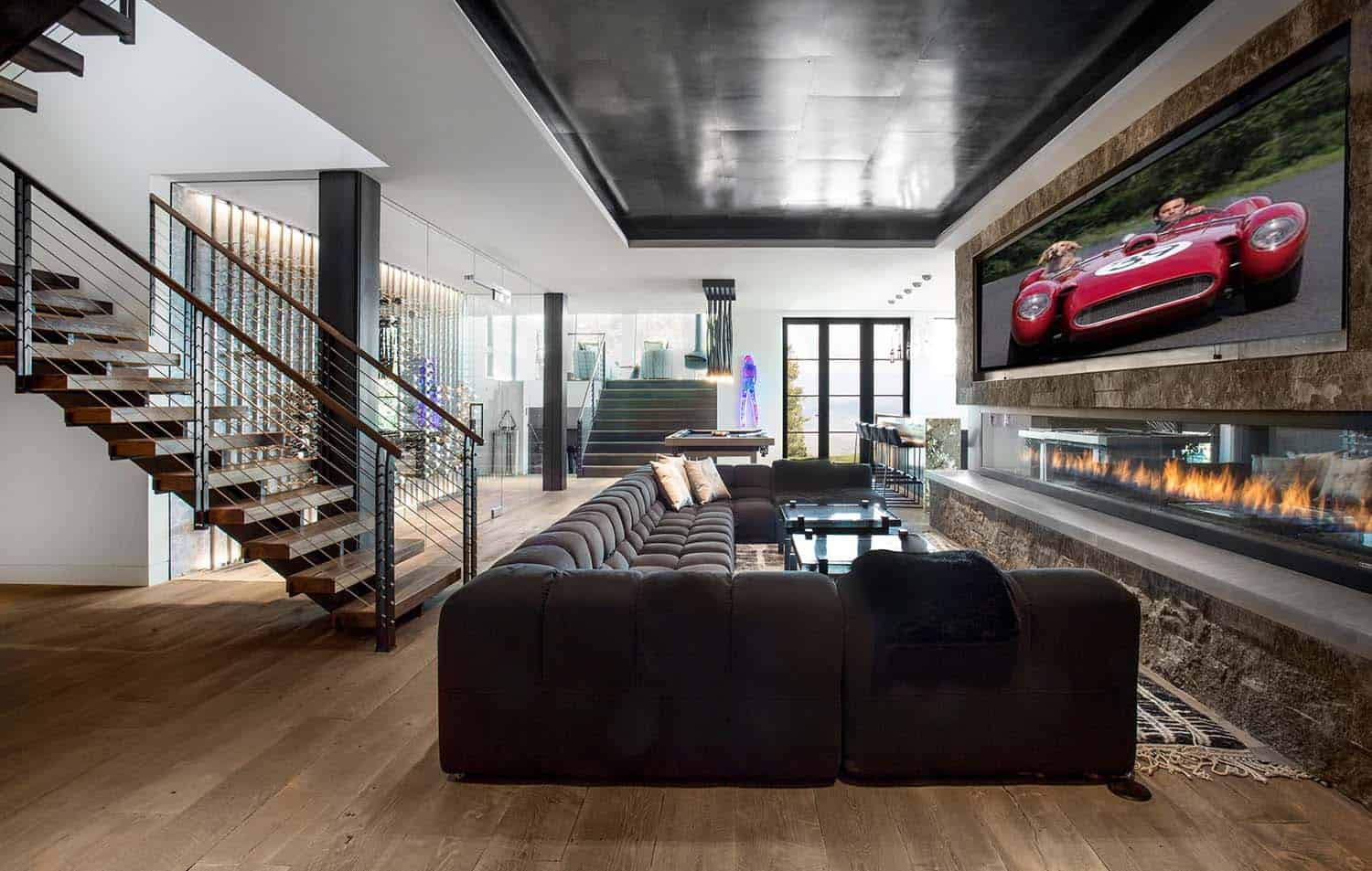 modern lower-level family room with a fireplace