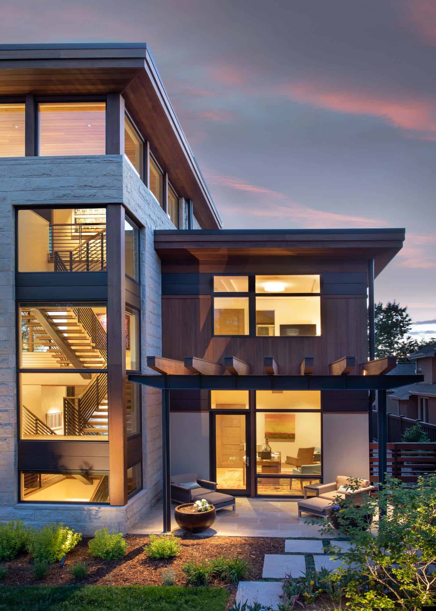modern urban house exterior backyard at dusk