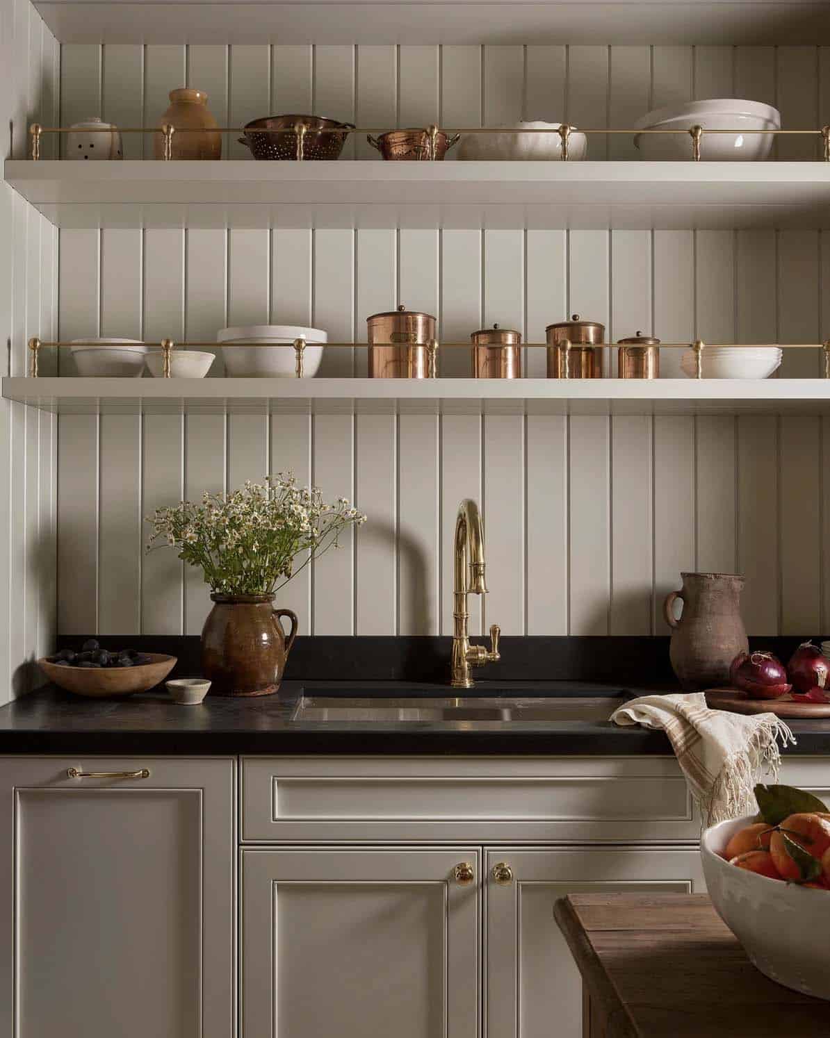 transitional style pantry with a sink and open shelves