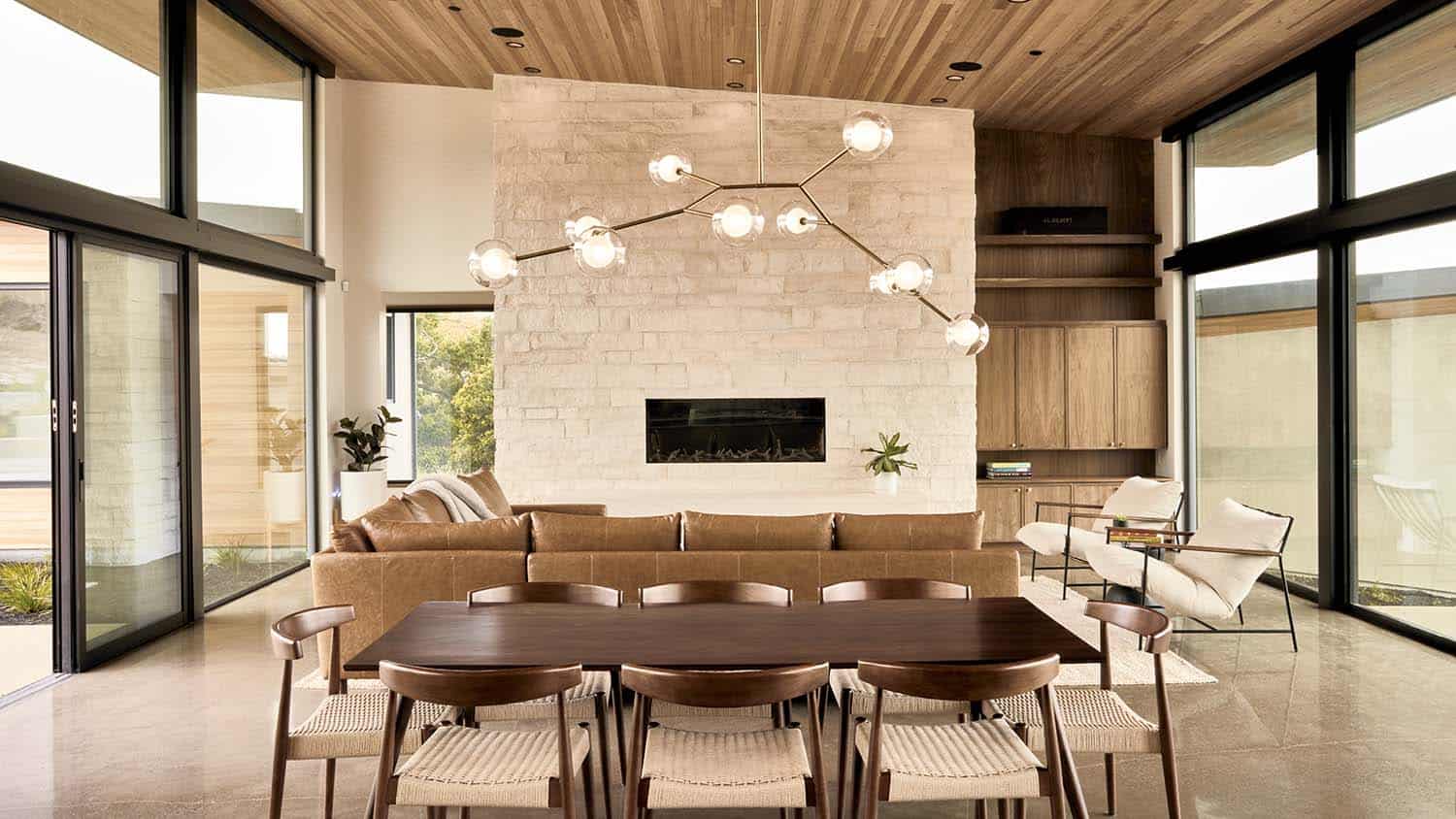 modern dining room with a large chandelier