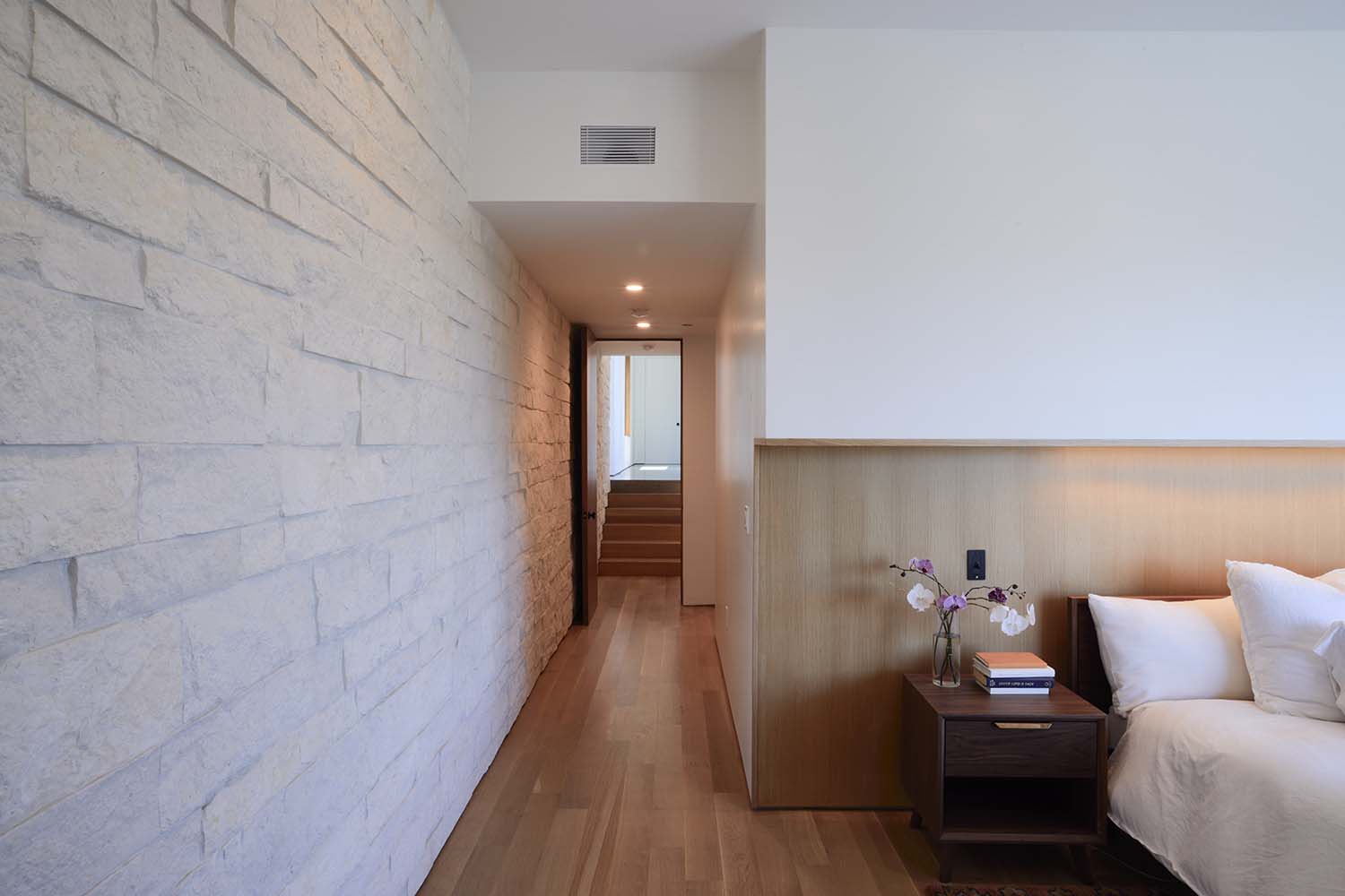 modern bedroom with a hallway