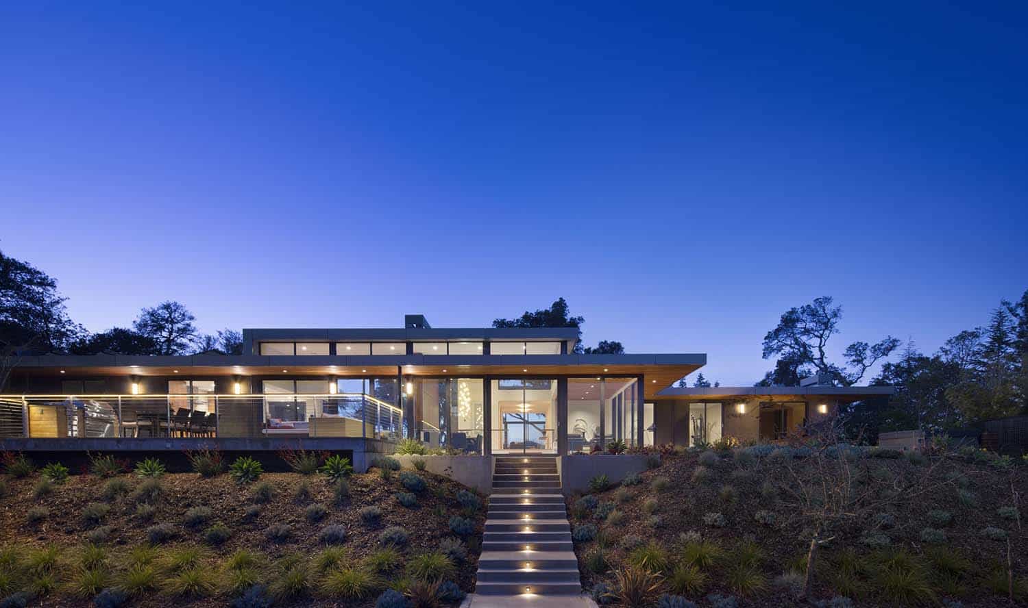 modern house exterior rear view at night