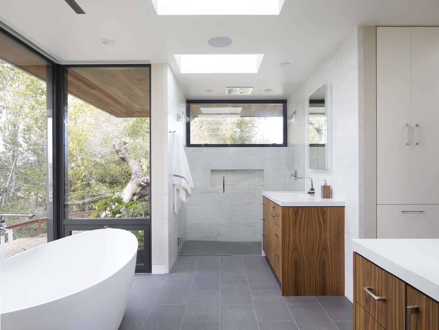 modern bathroom with a freestanding tub and marble shower
