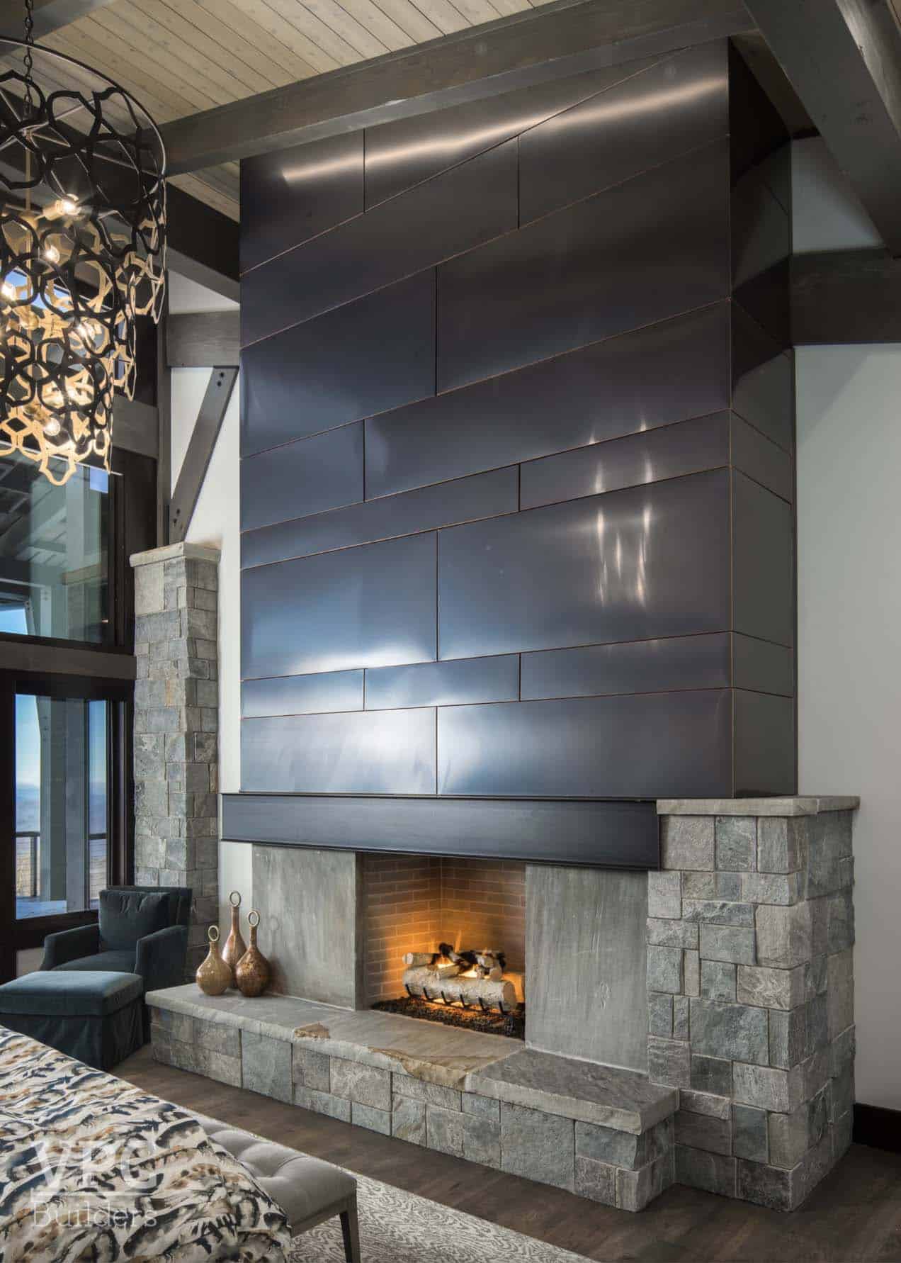 contemporary bedroom with a fireplace