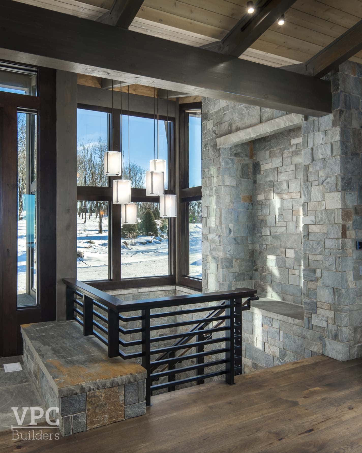 contemporary home entry with a staircase leading down to the lower level