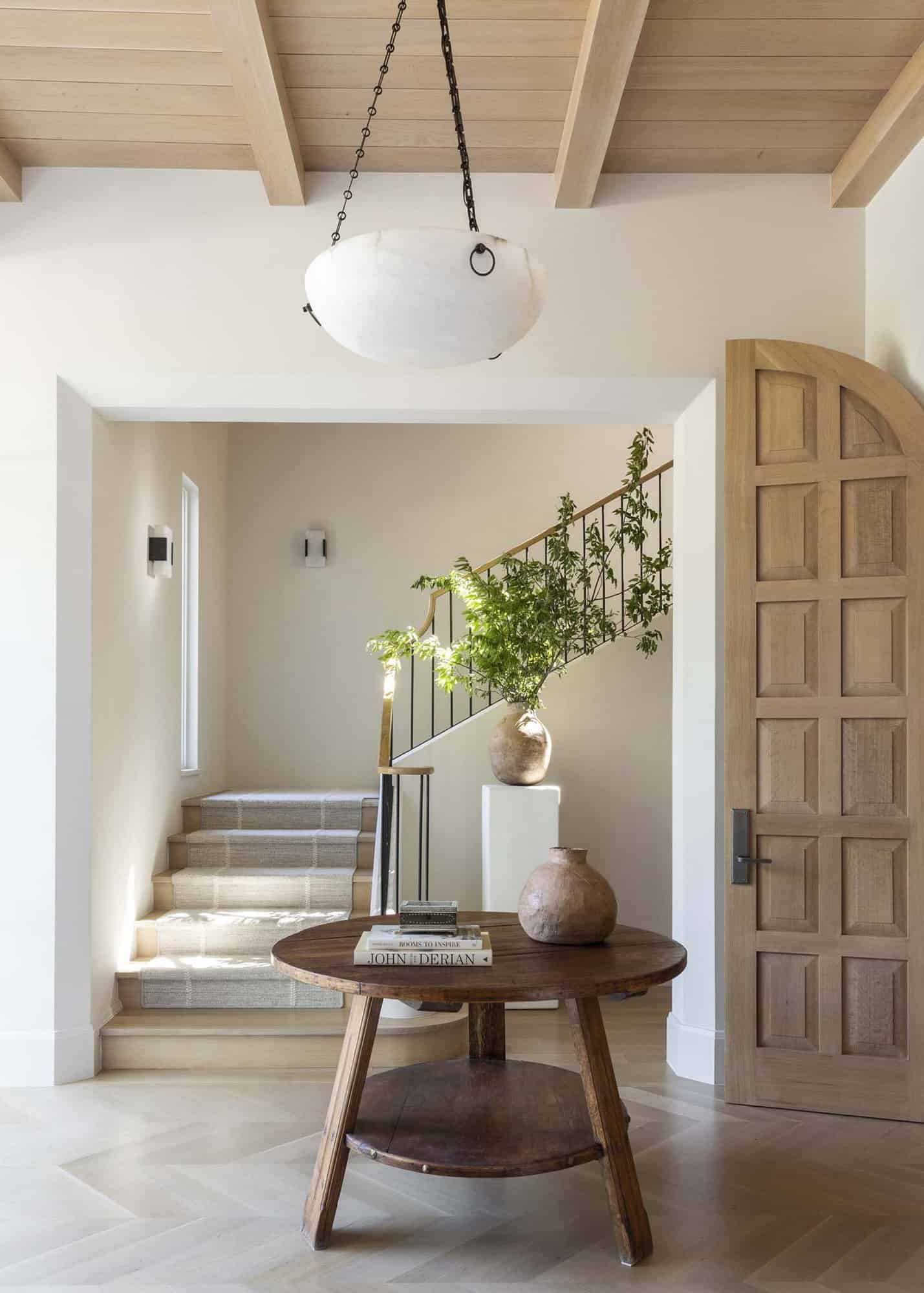 French provincial house entry with a staircase