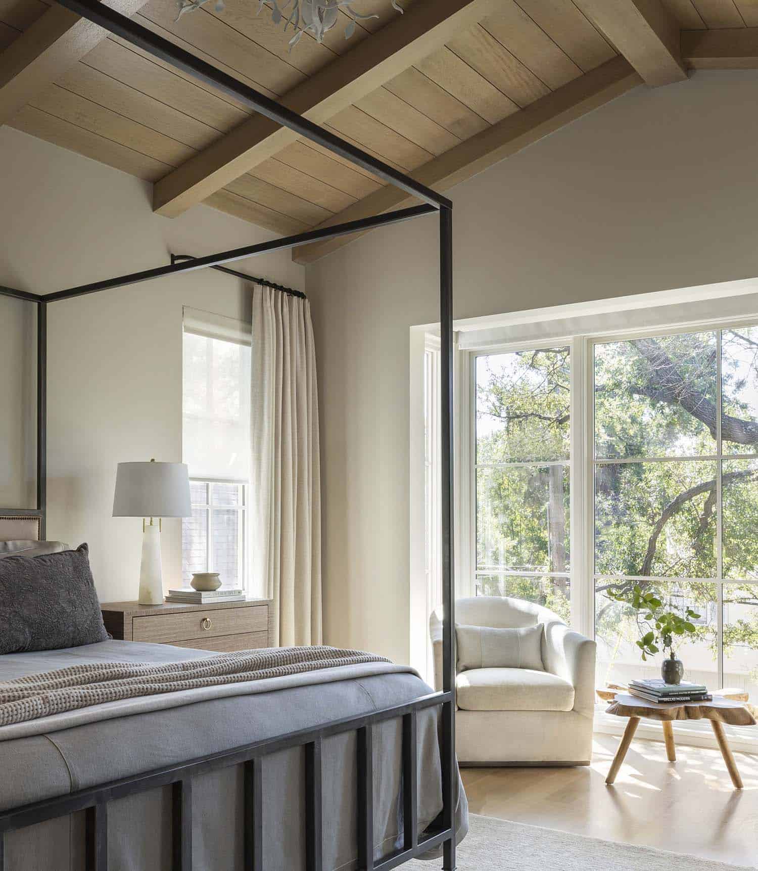 French provincial bedroom with a canopy bed