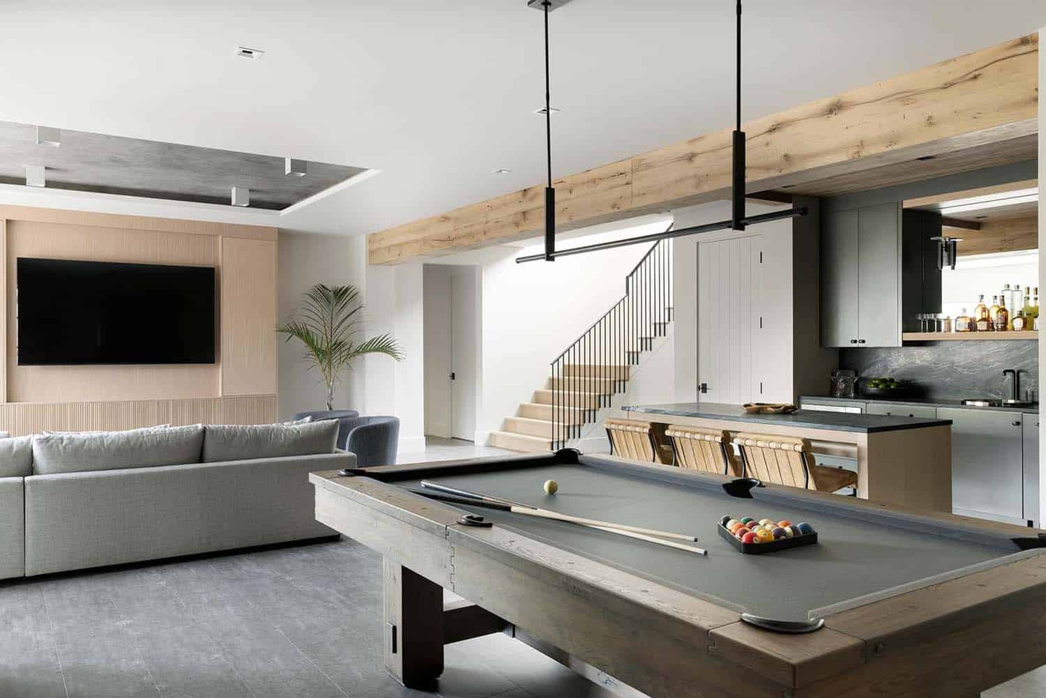 modern pool table on the lower level