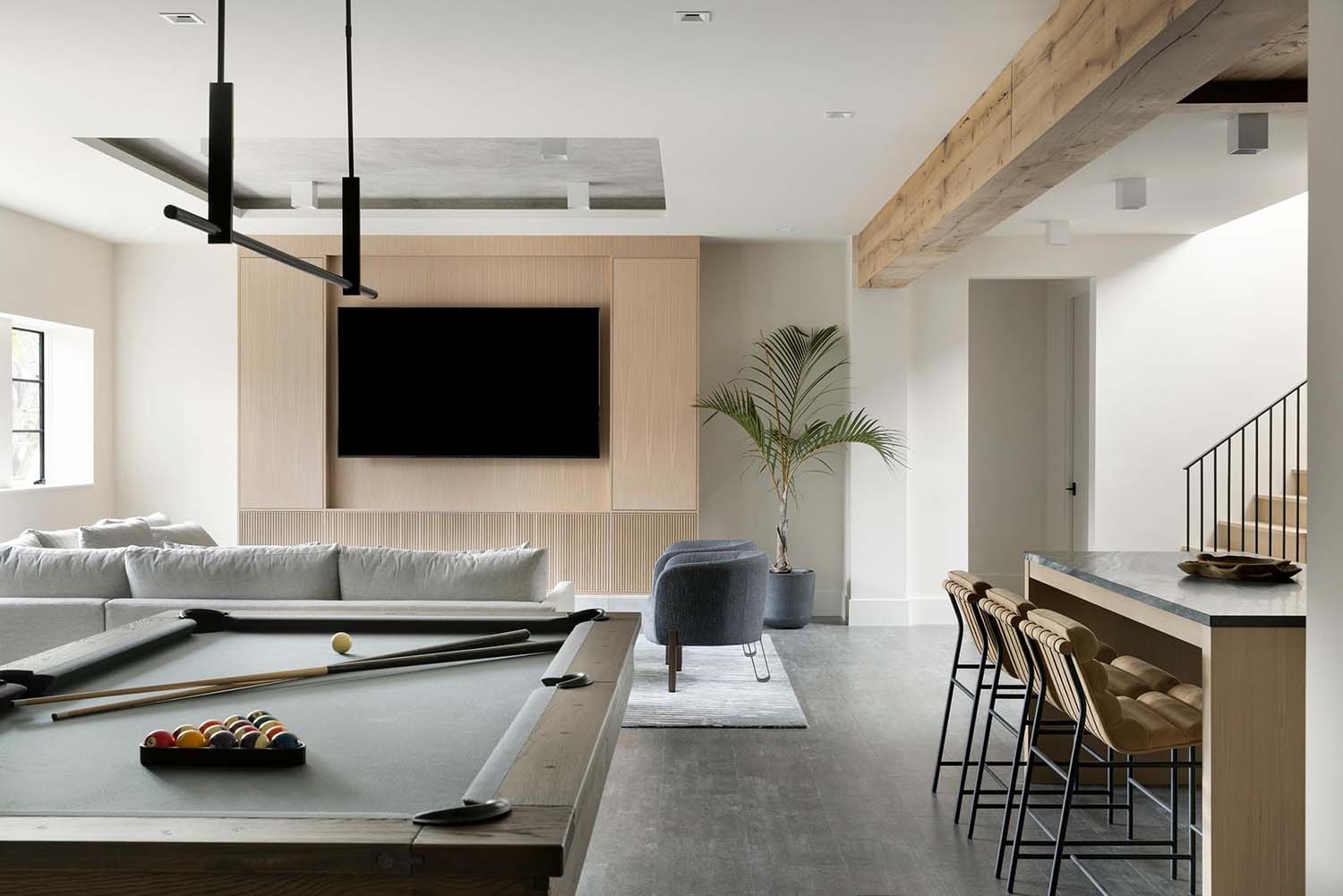 modern pool table on the lower level