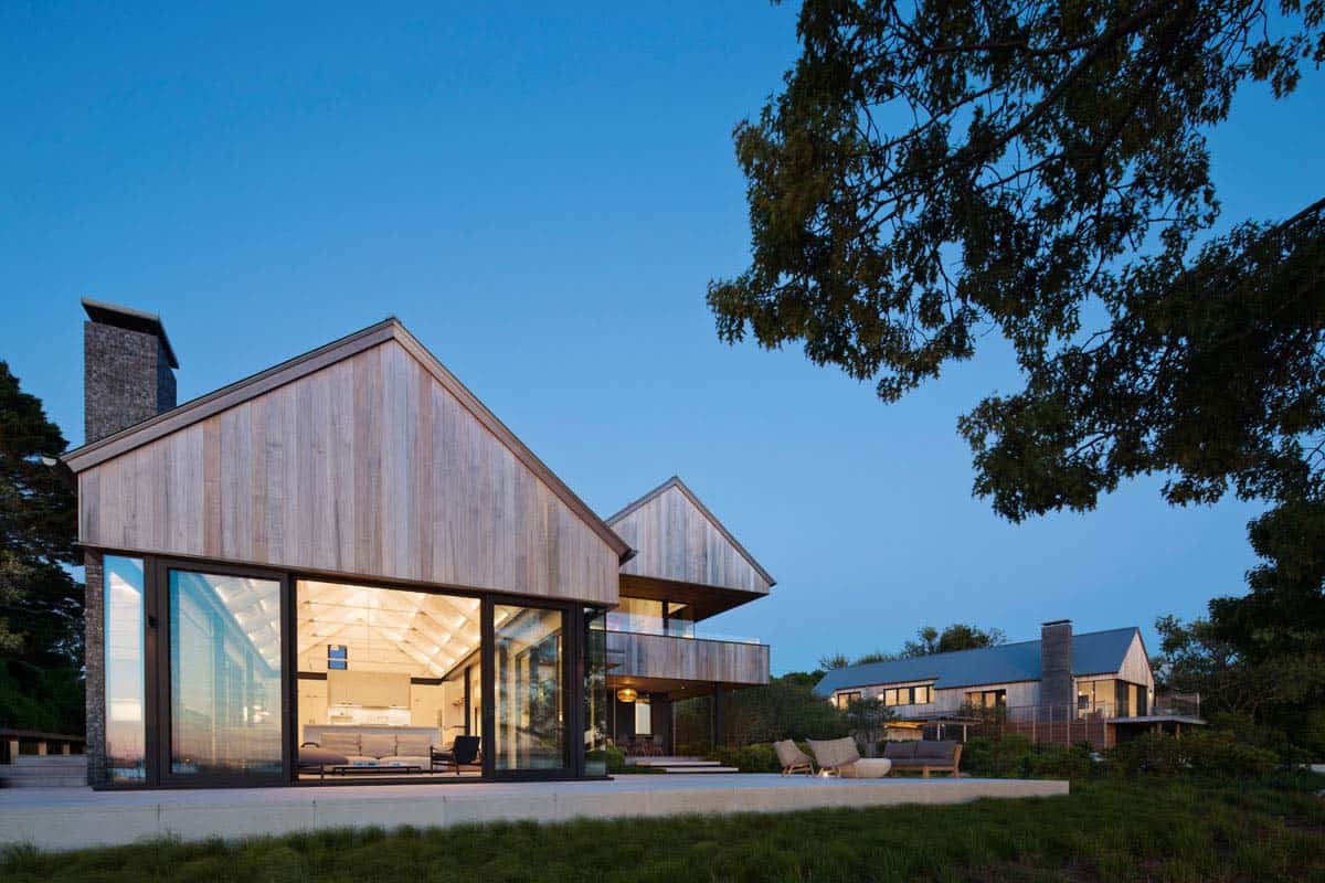 cedar clad lake house exterior at dusk