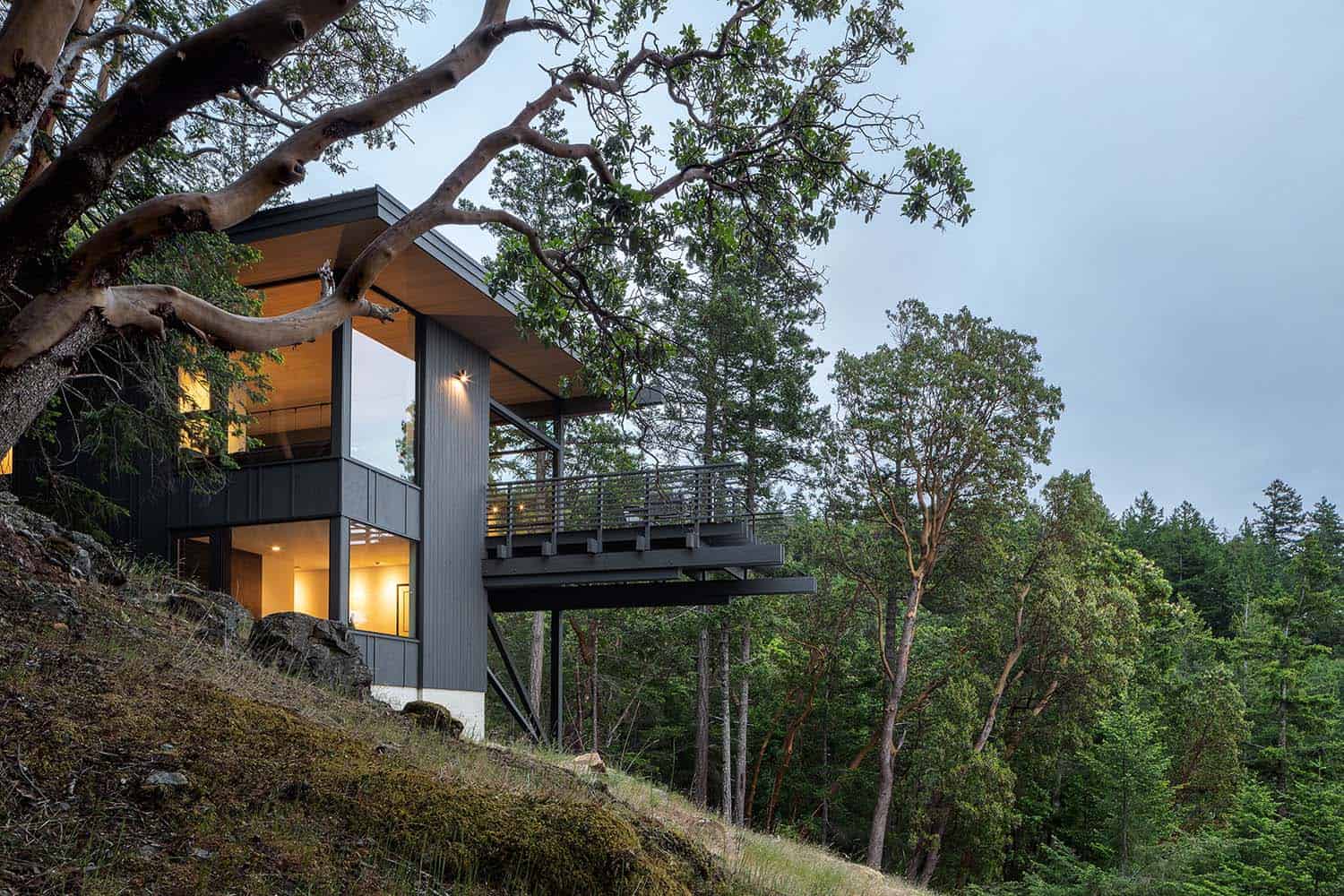 contemporary mountain cabin exterior at dusk