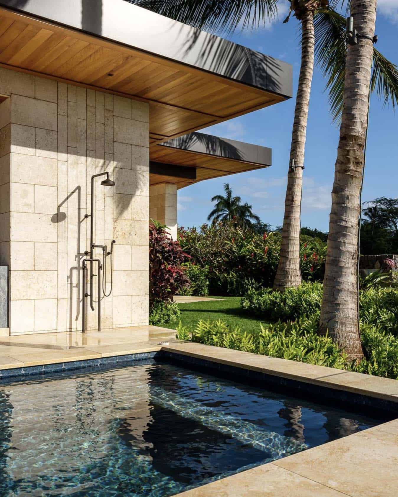 outdoor pool shower on the wall of the pool bath