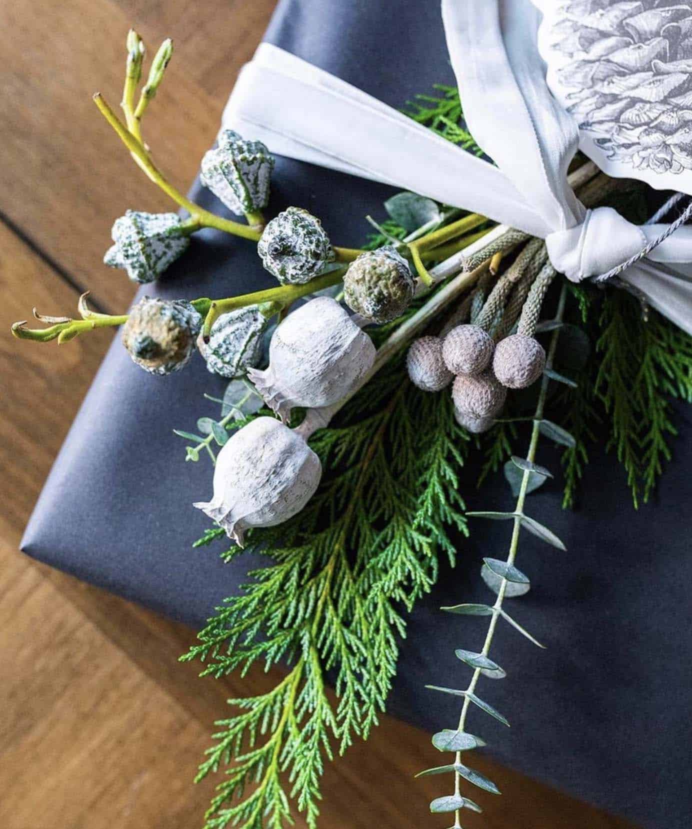 christmas presents with fresh greenery