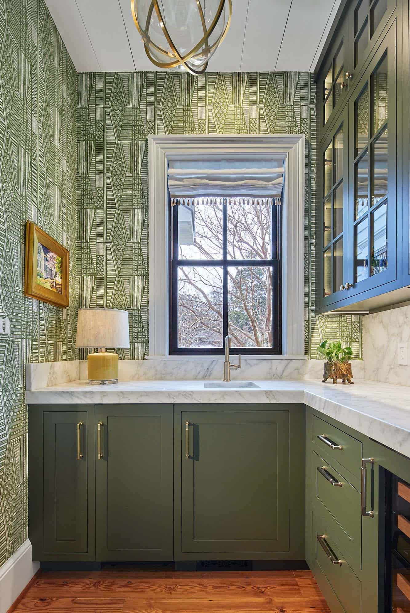 contemporary kitchen pantry with green cabinets