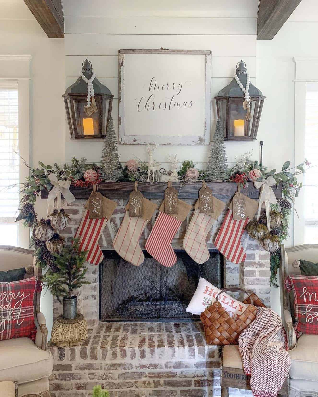 farmhouse style christmas mantel with stockings and garland