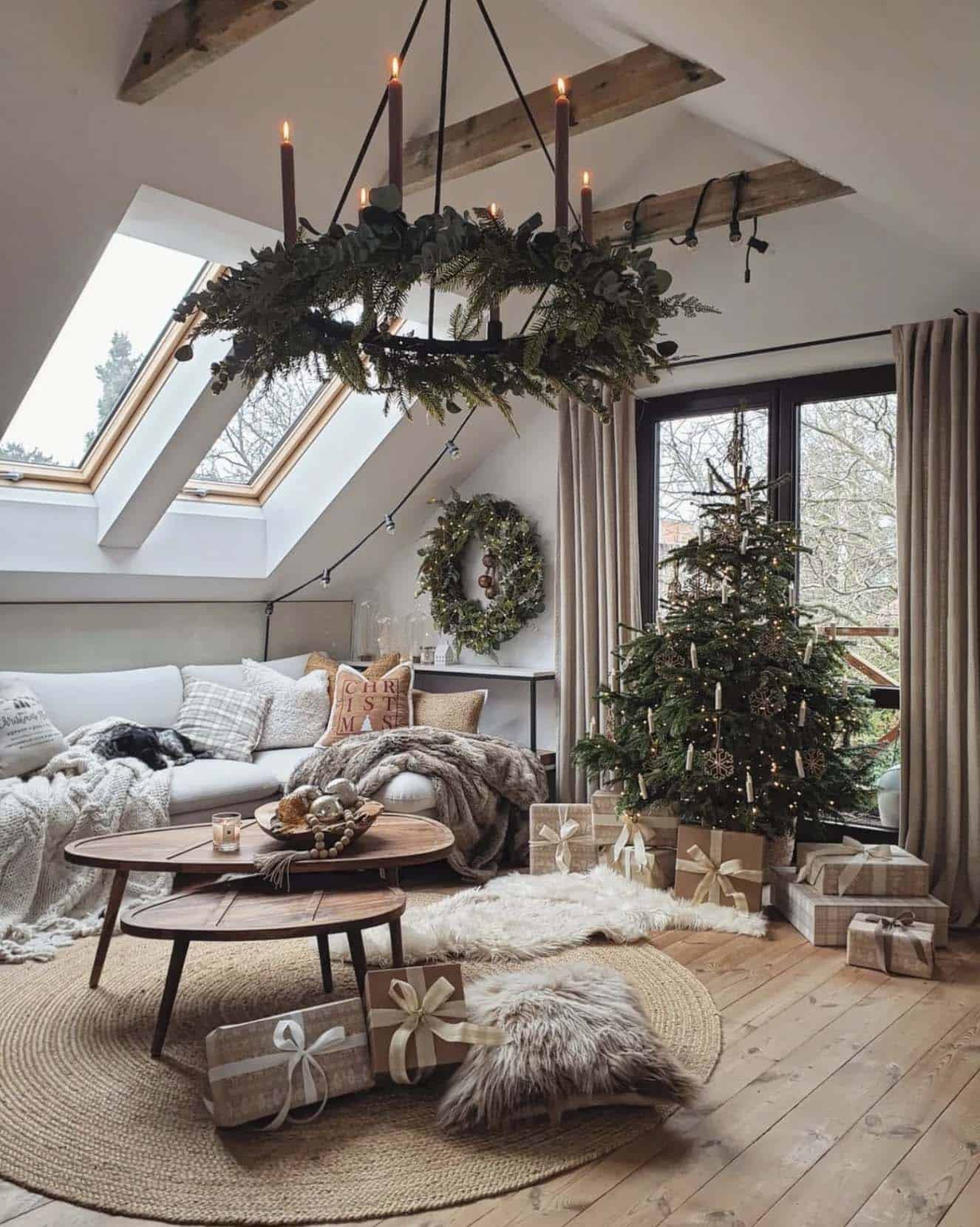 christmas decorated living room with a wreath chandelier