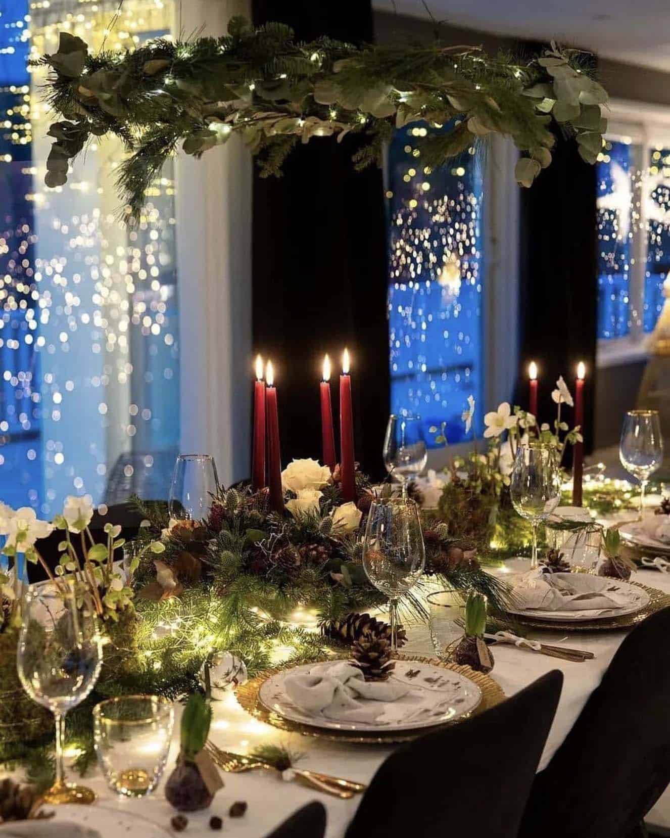christmas decorated dining table with a wreath chandelier