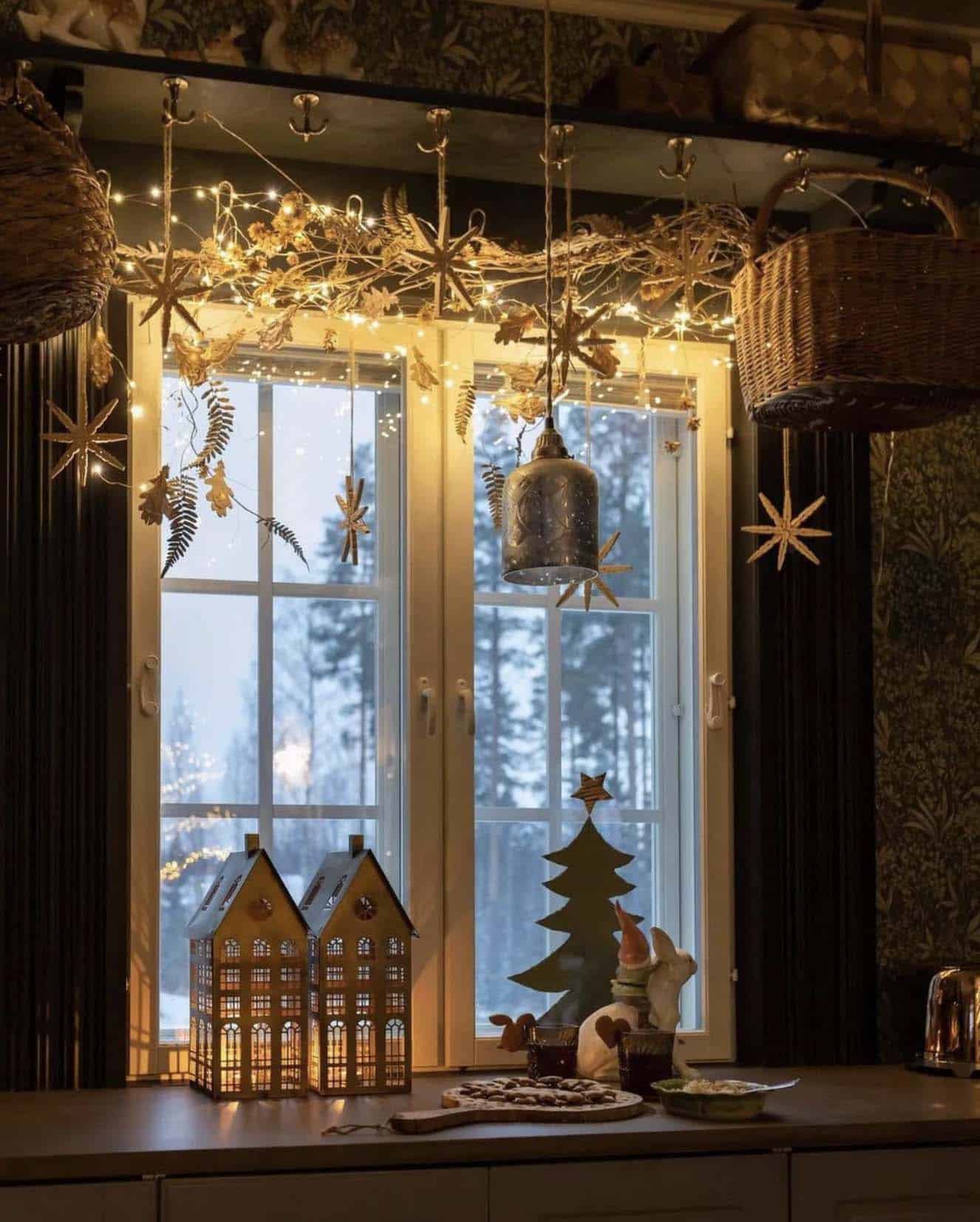 christmas decorated window with garland and fairy lights
