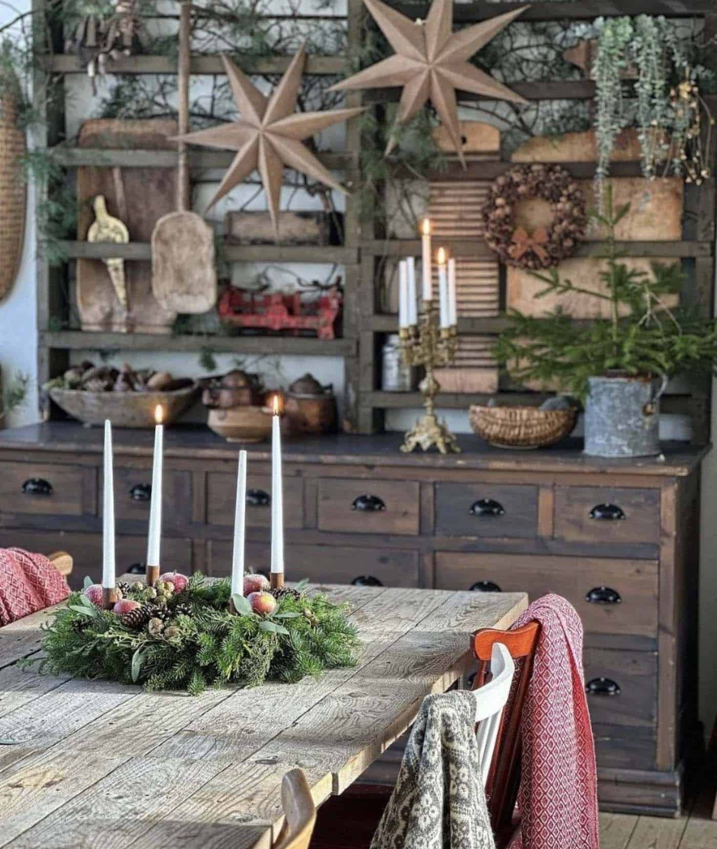 christmas decorated dining table with a centerpiece and stars